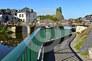 River and flowery bridge at Josselin in France