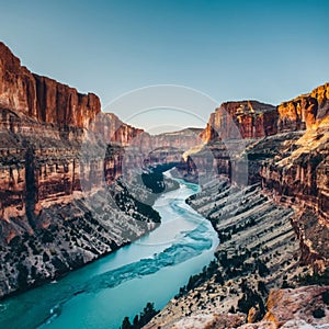 A river flowing through a canyon with steep cliffs on both sides.