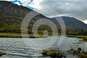 River flowing through a narrow mountain pass Gap of Dunloe in County Kerry, Ireland