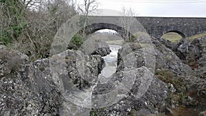 A river flowing through a narrow rocky gorge on the Water of Ken, Scotland