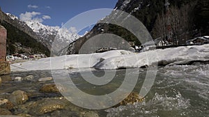 River flowing and snow mountain in gangotri