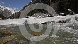 River flowing under the snow in gangotri uttrakhand