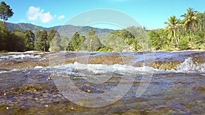 River flows stream fast against pictorial landscape