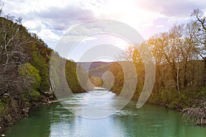 River among the forest and mountains. Spring