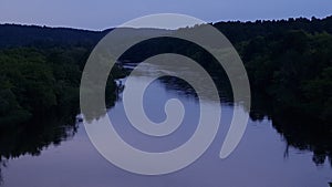 River and forestland on summer evening