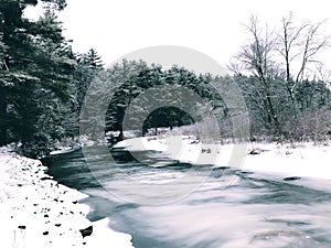 A river frozen and covered with snow