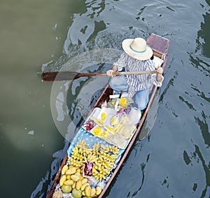 River fruit vendor, floating market, Bangkok, Thai photo