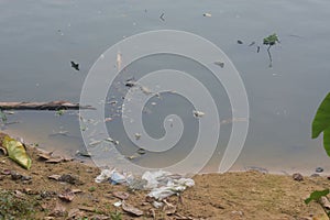 River with garbage. Polluted water, environment. Ecology concept.