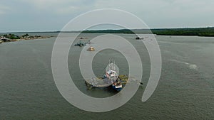 River going to the sea with fishing boats. Bislig, Surigao del Sur. Philippines.