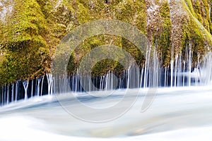 River with green moss