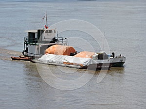 River Hidrovia Paraguay Parana Motor Vessel ÃÂ´DOÃâA FLOR` and a Barge photo