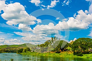River with hills sky background.