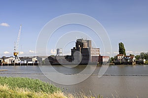 River Hollandsche IJssel with timber factory near Ouderkerk and Nieuwerkerk aan den IJssel