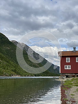 River house in Norway. By the mountain. Nostalgic.