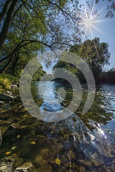 River Hron near village of Sliac with sun