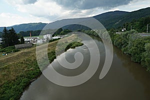 River Hron in Slovakia around town Zarnovica. There is an old industrial zone on the left bank and a highway on the right bank.