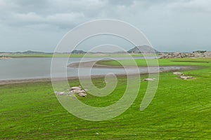 River of jawai dam is greener and also water and mounten beautiful sky summer