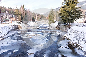 River Labe Elbe with ice in winter in the ski areal Spindleruv Mlyn