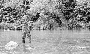 River lake lagoon pond. Trout farm. Fish farming pisciculture raising fish commercially. Fisherman alone stand in river