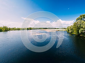 River Or Lake Landscape. Ripple Surface Of Calm Water At Sunny Day