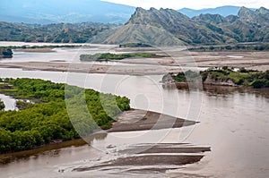 River between mountains near a dam. Huila Colombia photo