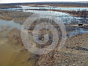 River Early spring. bare trees, melting snow
