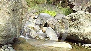 River landscape with some nature small waterfalls on Muria mountain, Indonesia