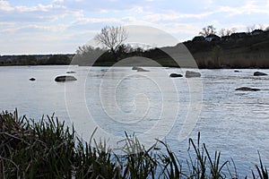 River with large granite stones. Steppe. Nature