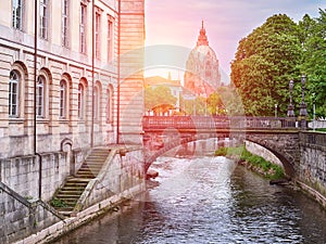 River Leine in Hanover city. City Hall background. View at sunset