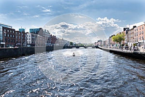 River Liffey and colorful buildings at summer day in Dublin, Ireland