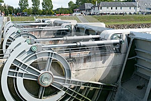 River locks and weir to regulate water flow in canal system photo