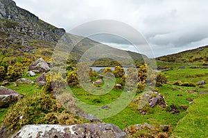 The River Loe and narrow mountain pass road wind through the steep valley of the Gap of Dunloe, County Kerry, Ireland