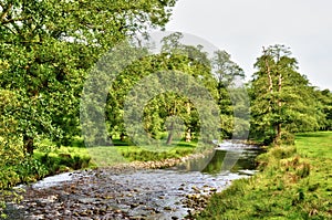 River meandering though lush English countryside