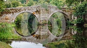 River and medieval bridge in Allariz, Orense, Spain photo