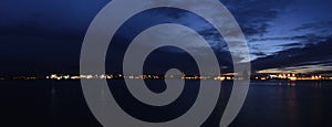 River Mersey and Birkenhead by night - panoramic view from Keel Wharf waterfront in Liverpool, UK