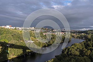 River Minho as it passes through the city of Luego on an autumn day at sunset. Galicia, Spain. photo