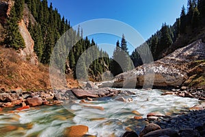 A river in the mountains of Kyrgyzstan in the Semenovsky gorge high mountains