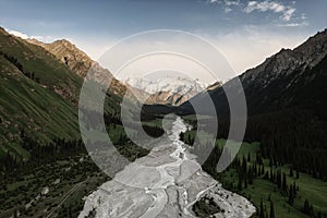 River and mountains with white clouds