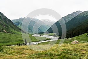 River and mountains with white clouds