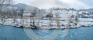 The river and the mountains in the winter forest