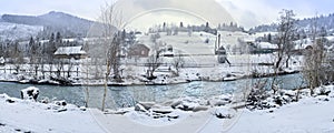 The river and the mountains in the winter forest