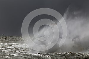 River mouth beacon and pier under heavy storm