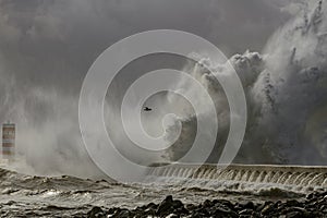 River mouth pier and beacon under heavy storm