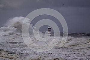 River mouth pier and beacon under storm