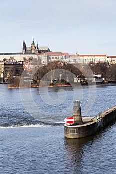 River navigation sign on Vltava with Hradcany castle, Prague, Bohemia