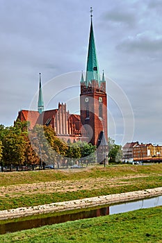 The river and neo-Gothic church with belfry