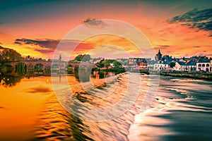 The River Nith and old bridge at sunset in Dumfries, Scotland photo