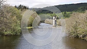 River Oich Fort Augustus Scotland UK Scottish Highlands popular tourist village next to Loch Ness with bridge tower