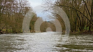 River Ourthe with bare winter trees on the shores photo