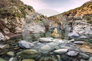 River passing through Genoese bridge at Asco in Corsica